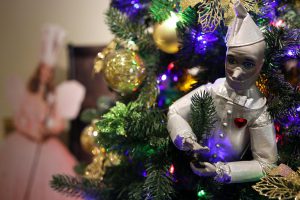 A closeup of a Tin Man ornament on a Wizard of Oz themed tree